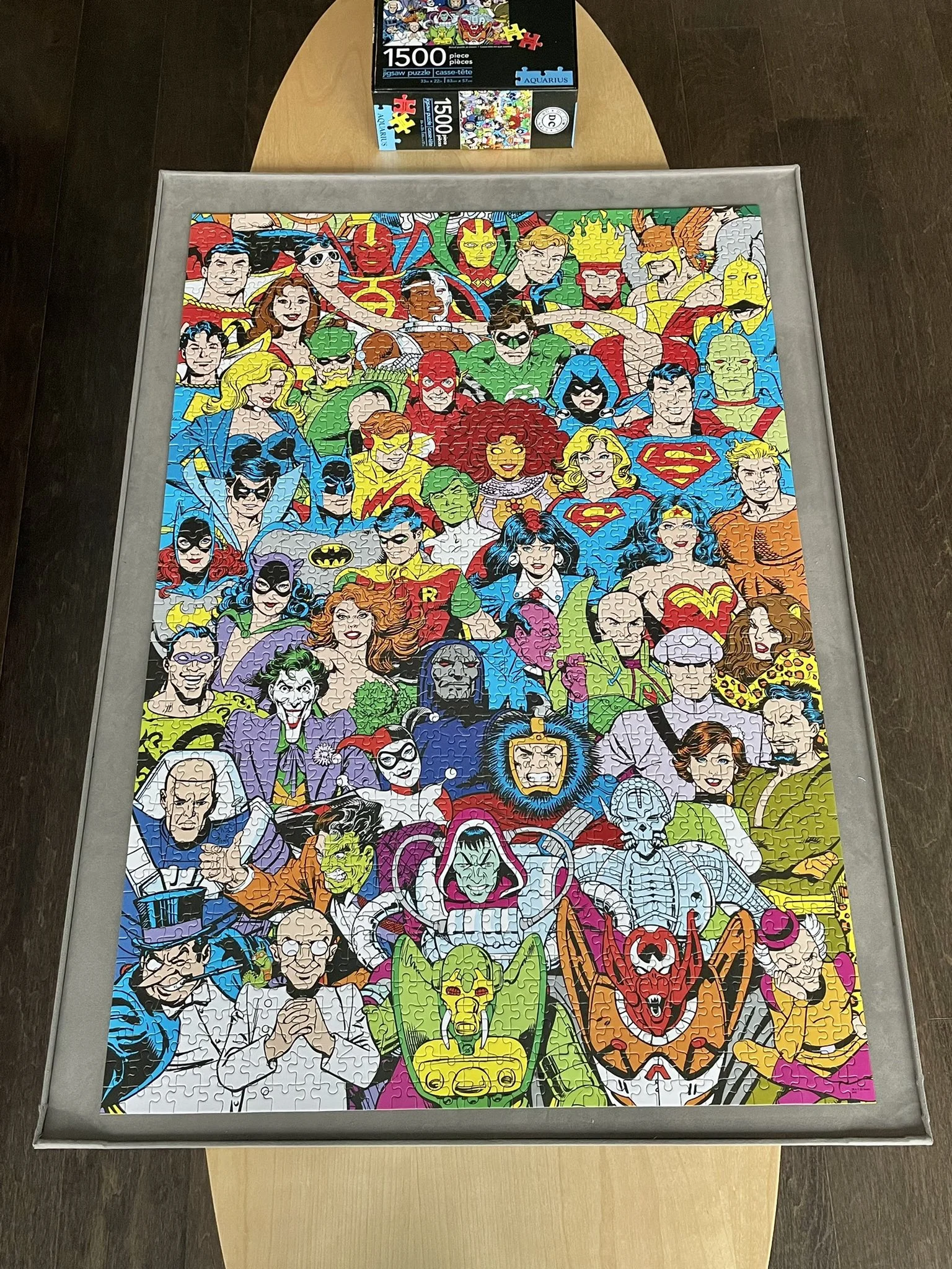 1500 piece puzzle featuring lots of comic book characters from the DC universe.